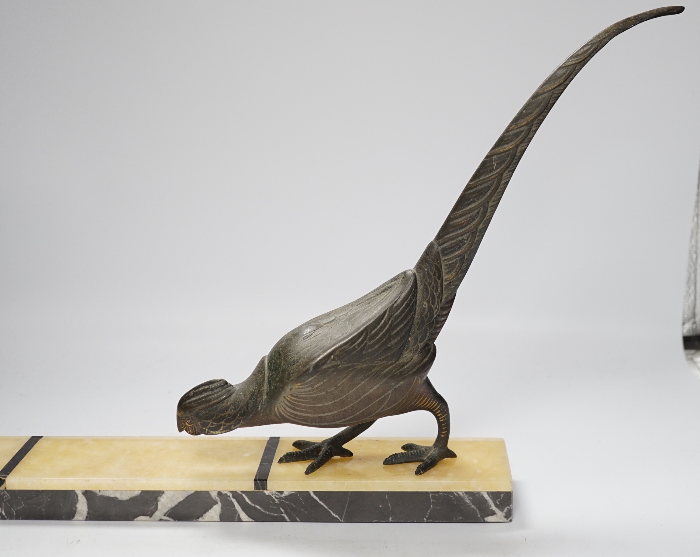 An Art Deco style spelter pheasant on rectangular onyx base, 55cm wide